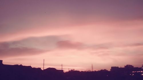 Silhouette of wind turbines at sunset