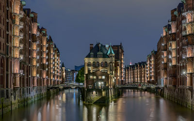 Panoramic view of illuminated city against sky at night