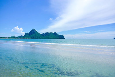 Scenic view of sea against blue sky