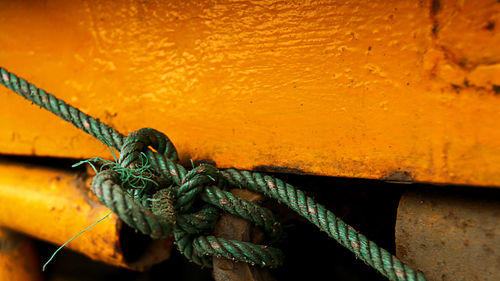 Close-up of rope tied on metal