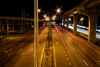 High angle view of light trails on road at night