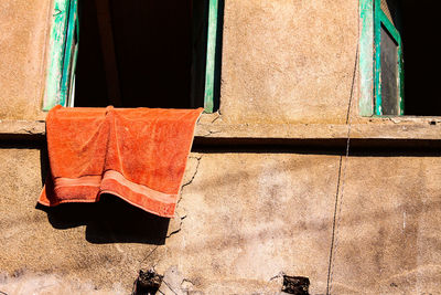 Close-up of clothes drying against window
