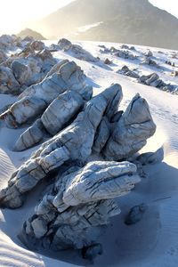 High angle view of snow on rocks