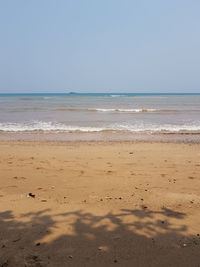 Scenic view of beach against clear sky