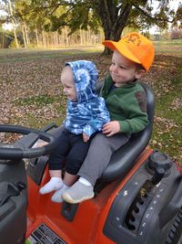 Low section of man with bicycle on field