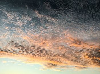 Low angle view of dramatic sky during sunset