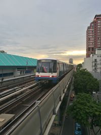 Train on railroad tracks against sky