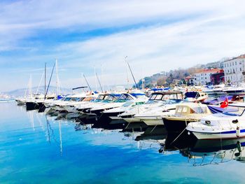 Boats moored at harbor