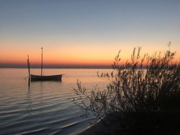 Scenic view of sea against clear sky during sunset