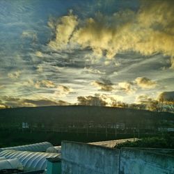 Clouds over landscape at sunset