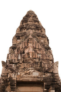 Low angle view of statue against temple against clear sky