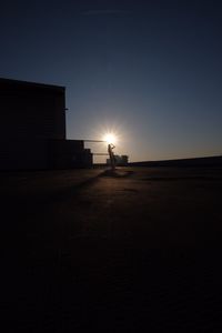 Silhouette of city at sunset