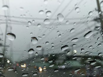 Full frame shot of raindrops on glass window