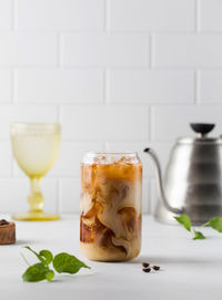 Cold black coffee with ice cubes and cream. coldbrew. summer drinks.