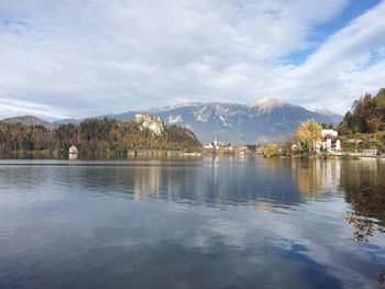 Scenic view of lake and mountains against sky