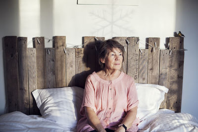 Senior woman sitting in bed