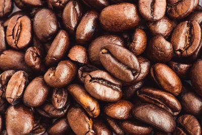 Roasted coffee beans background, close up, top view