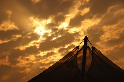 Low angle view of silhouette bridge against sky during sunset