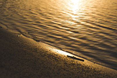 High angle view of wet sand on beach