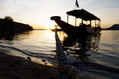 Silhouette of boat at sunset