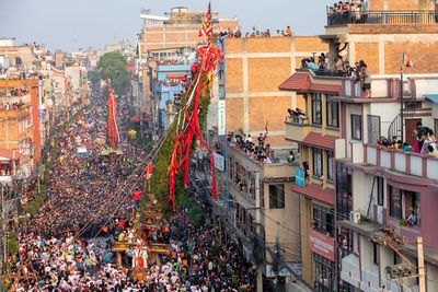 Devotees pull chariots as they take part in the festivities to mark the rato machindranath chariot.