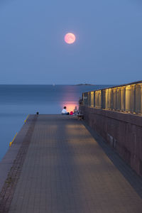 Scenic view of sea against clear sky during sunset