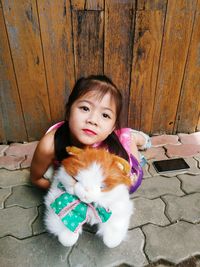 Portrait of cute girl with arms outstretched