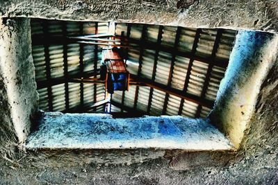 High angle view of person on metal railing