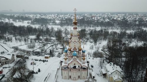 Panoramic view of cathedral against sky during winter
