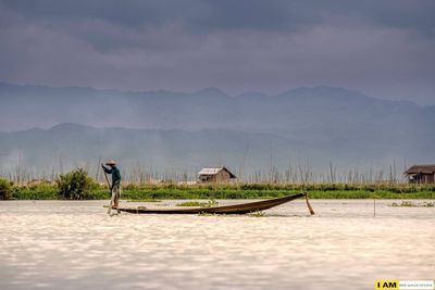 Scenic view of sea against cloudy sky