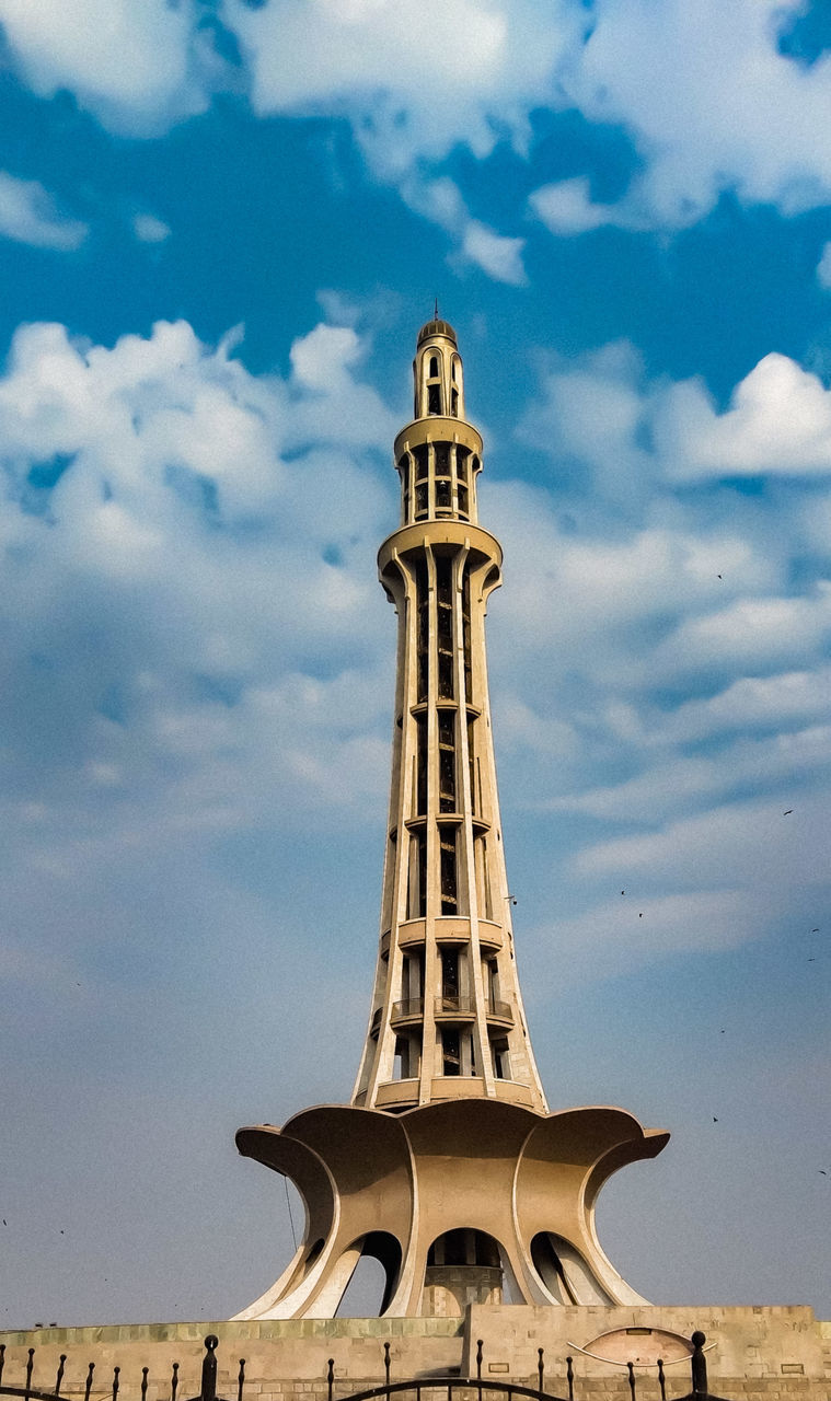 LOW ANGLE VIEW OF MONUMENT AGAINST CLOUDY SKY