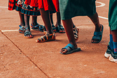 Low section of people standing on street