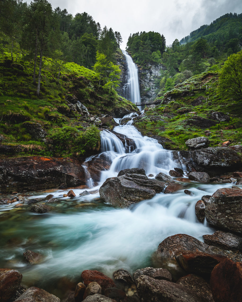 water, scenics - nature, beauty in nature, waterfall, environment, nature, body of water, land, rock, forest, tree, water feature, motion, plant, stream, landscape, river, long exposure, travel destinations, flowing water, autumn, watercourse, flowing, travel, outdoors, no people, non-urban scene, tourism, sky, rapid, wilderness, social issues, wet, holiday, cloud, blurred motion, idyllic, trip, leaf, vacation, environmental conservation, fog, speed, power in nature, mountain