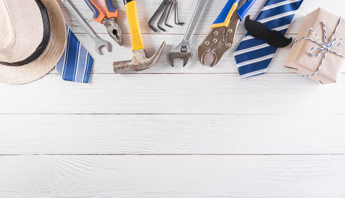 Low section of white shoes on table