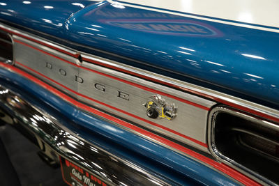 Close-up of cars moving on road in city