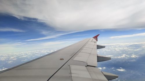 Aircraft wing against sky