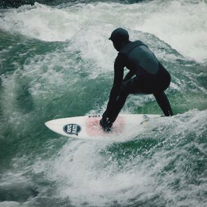 People surfing in sea