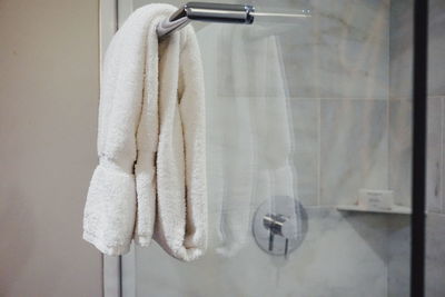 Close-up of towel hanging on pole in bathroom