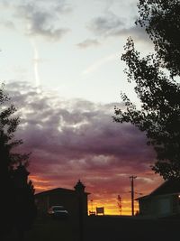 Silhouette city against sky during sunset