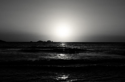 Scenic view of sea against clear sky during sunset