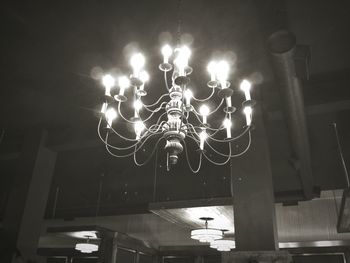 Low angle view of illuminated street light at night