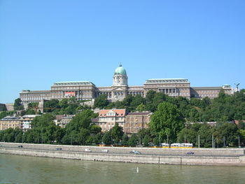 Built structure with trees in foreground