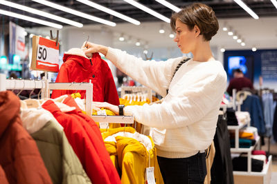 Woman shopping in clothing store