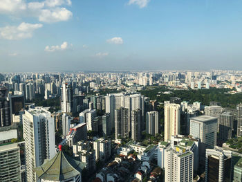 High angle view of modern buildings in city against sky