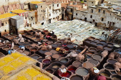 High angle view of people working at traditional dyeing pits