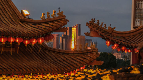 Low angle view of illuminated buildings in city