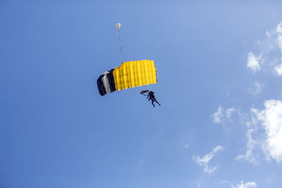 View of parachute descending with two people