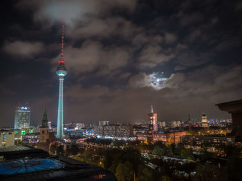 View of illuminated city against sky at night