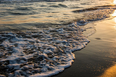 High angle view of sea shore during sunset