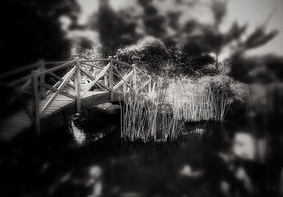 Close-up of bridge over river against sky